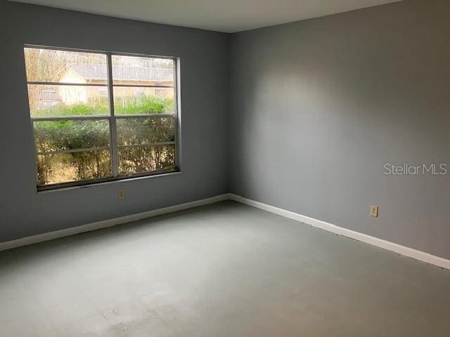 spare room featuring concrete floors