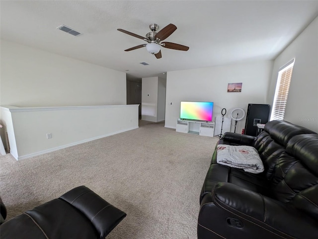 carpeted living room featuring ceiling fan