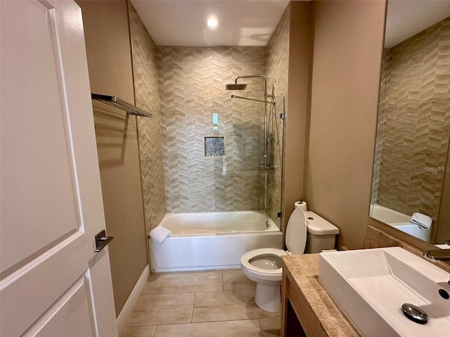 full bathroom with tile patterned flooring, vanity, toilet, and tiled shower / bath