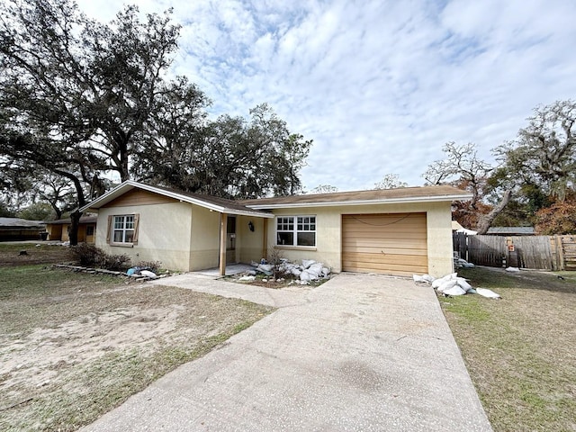 single story home with a garage