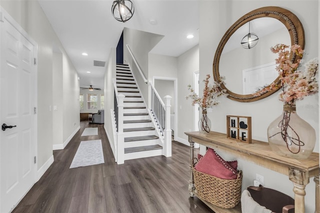 entryway featuring ceiling fan and dark hardwood / wood-style floors