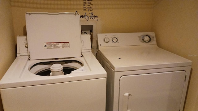 washroom with separate washer and dryer