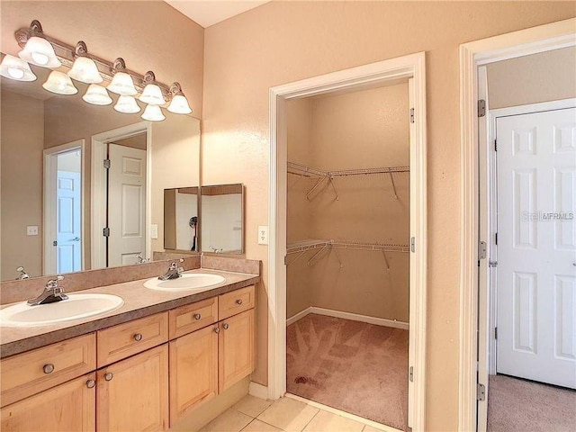 bathroom featuring tile patterned floors and vanity