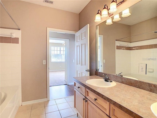 bathroom with tile patterned floors, vanity, and tub / shower combination