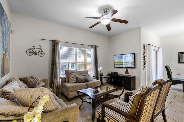 tiled living room with ceiling fan