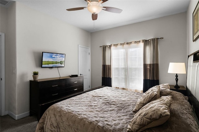 carpeted bedroom with ceiling fan