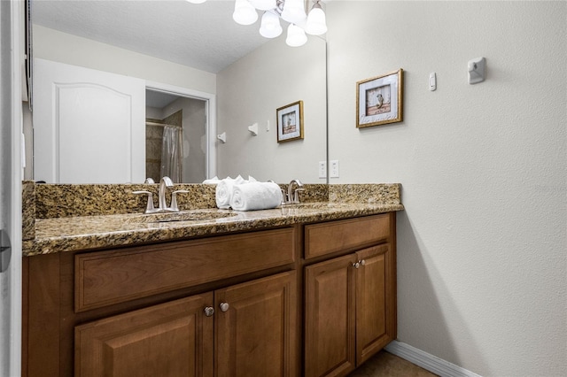 bathroom with vanity and walk in shower