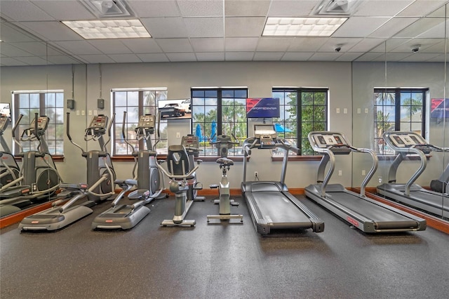 exercise room with a drop ceiling