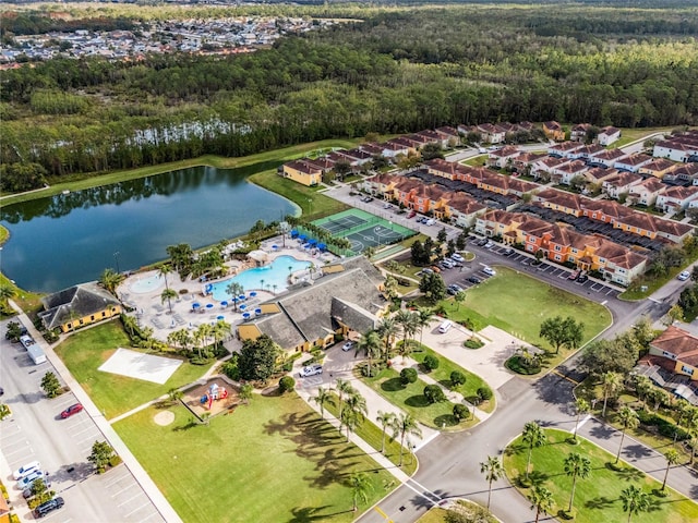 birds eye view of property with a water view