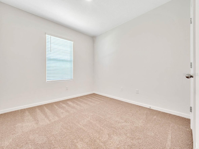 empty room featuring carpet floors