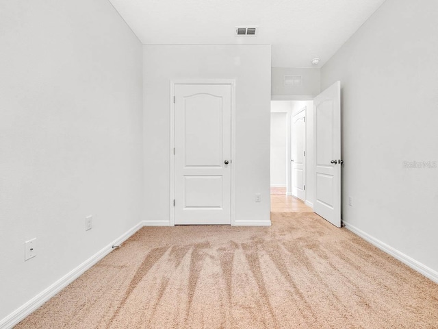 unfurnished bedroom with light carpet