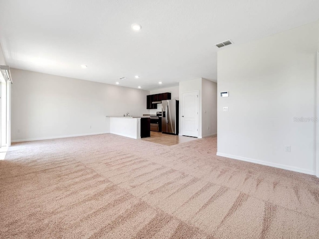 unfurnished living room with light carpet