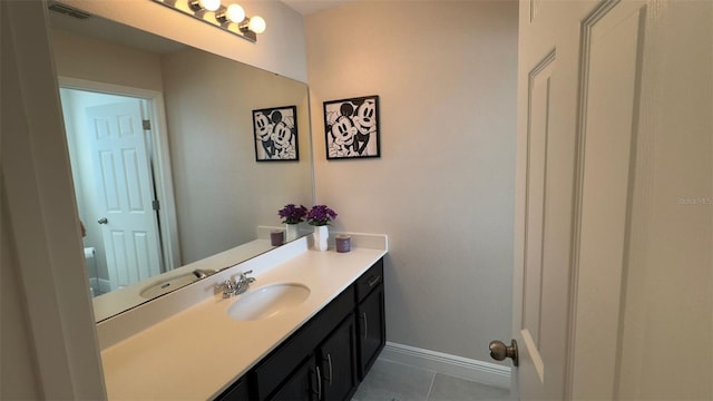 bathroom with tile patterned flooring and vanity