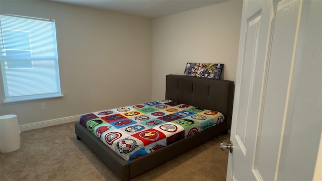 bedroom featuring light colored carpet