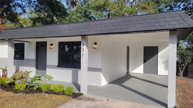 exterior space with a carport