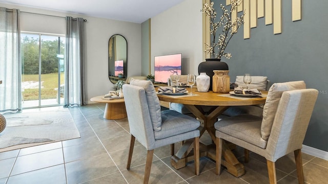 dining area with light tile patterned floors