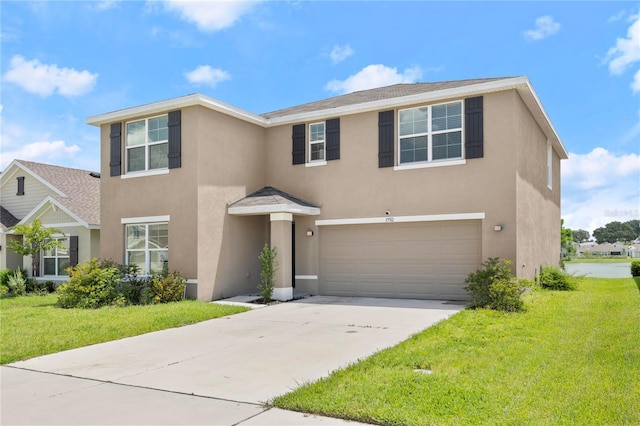 view of front of home featuring a front lawn and a garage