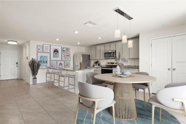 dining room featuring light tile patterned flooring