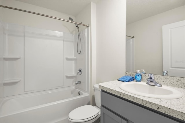 bathroom with toilet,  shower combination, and vanity