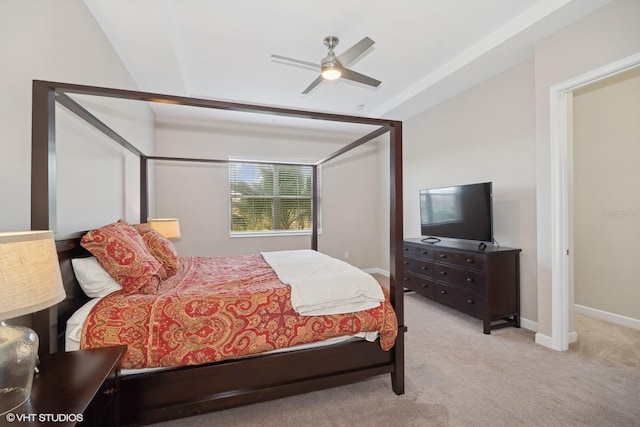 bedroom featuring ceiling fan, light colored carpet, and lofted ceiling