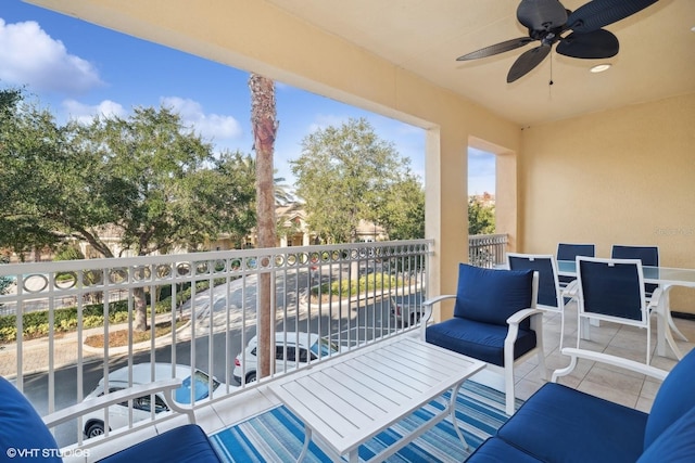 exterior space featuring ceiling fan and a balcony