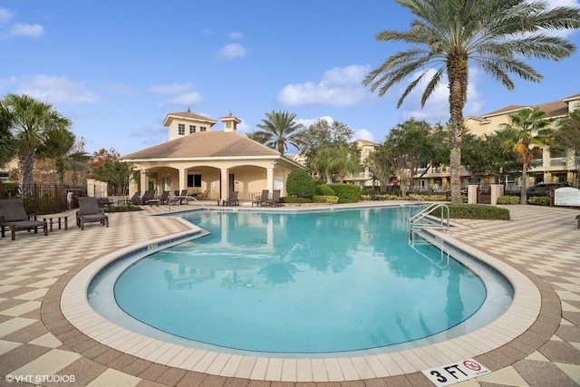 view of swimming pool with a patio