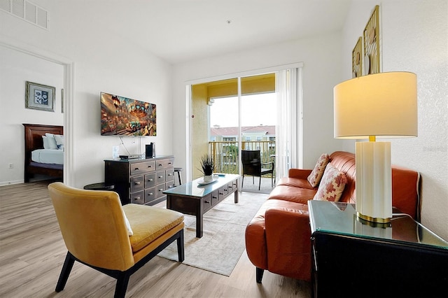 living room with light hardwood / wood-style floors