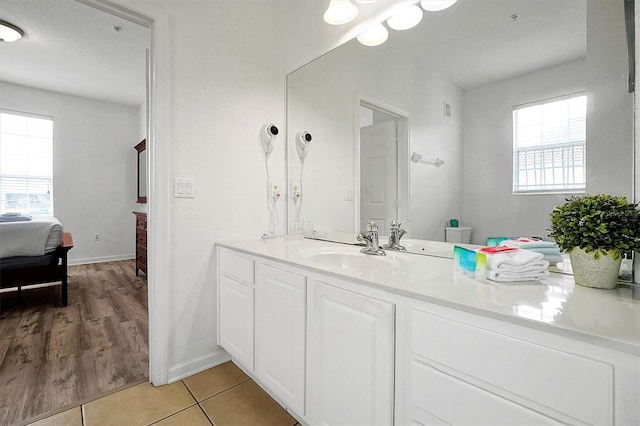 bathroom featuring tile patterned flooring, vanity, and toilet