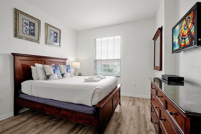 bedroom with light hardwood / wood-style floors