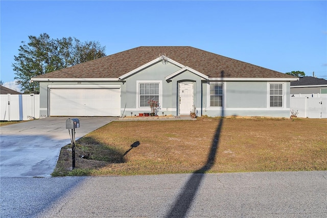 single story home with a garage and a front yard