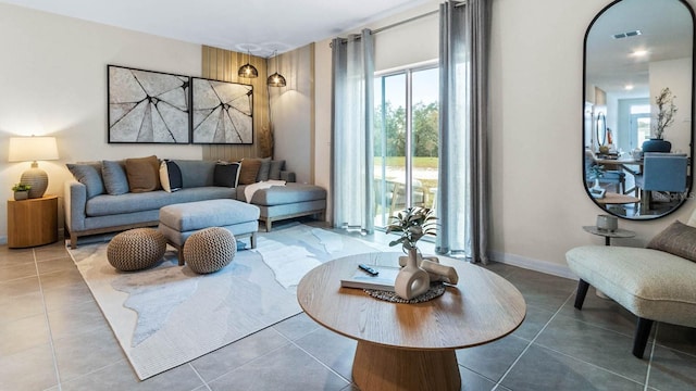 living room with tile patterned flooring