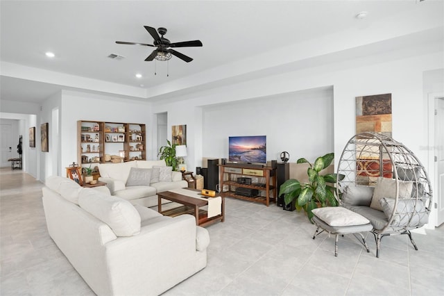 living room with visible vents, recessed lighting, a raised ceiling, a ceiling fan, and light tile patterned floors