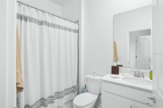 bathroom with vanity, toilet, and a shower with curtain