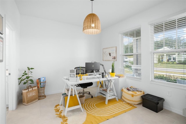 office area with tile patterned floors and baseboards