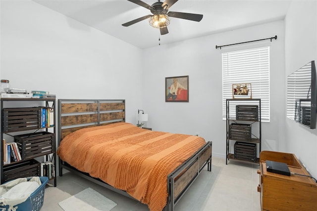 bedroom featuring a ceiling fan and light tile patterned floors