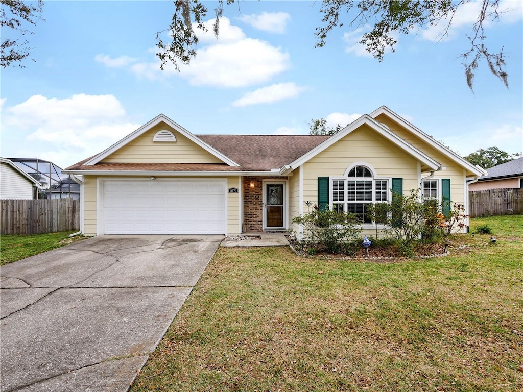 single story home with a front yard and a garage