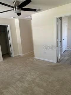 unfurnished bedroom featuring ceiling fan