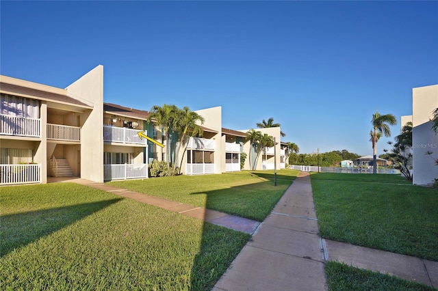 view of home's community with a lawn