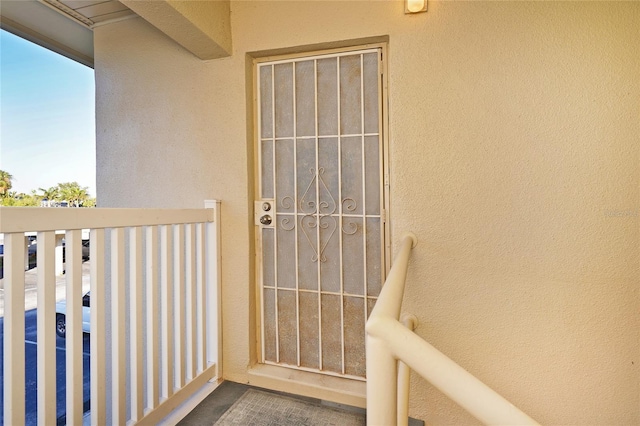 entrance to property featuring a balcony