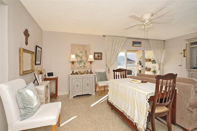 bedroom featuring ceiling fan and a textured ceiling