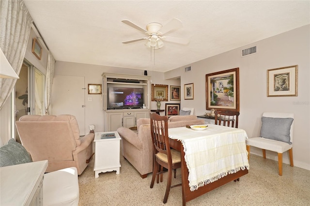 dining space with ceiling fan and a textured ceiling