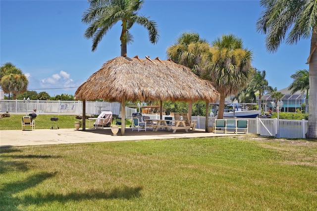 view of community featuring a gazebo, a patio area, and a yard