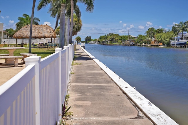 dock area with a gazebo and a water view