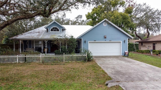 view of front of property featuring a porch, a garage, and a front lawn