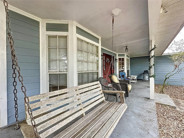 view of patio featuring covered porch