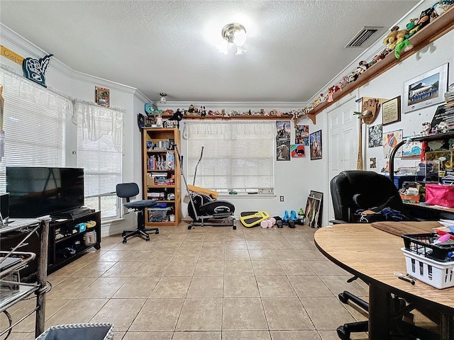 home office featuring a textured ceiling, light tile patterned floors, and crown molding