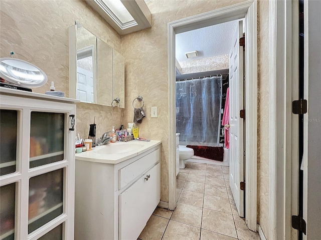 full bathroom featuring tile patterned floors, vanity, shower / tub combo, and toilet