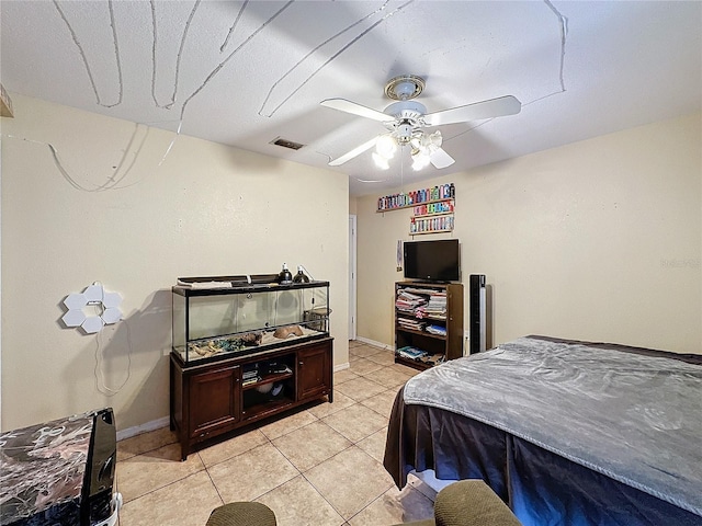 bedroom featuring light tile patterned floors and ceiling fan