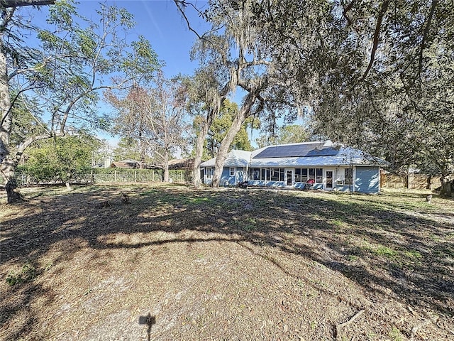 view of front of home featuring solar panels