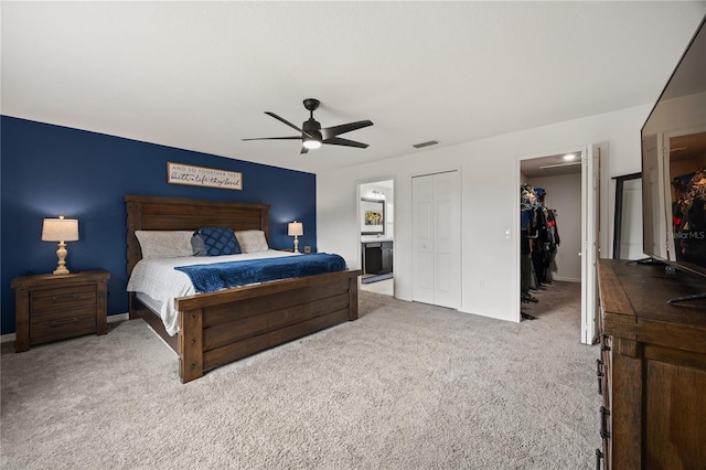 carpeted bedroom with ceiling fan